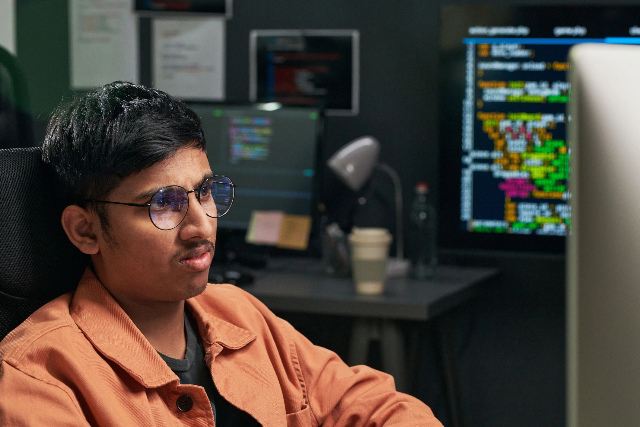Software engineer working at a computer in a modern office